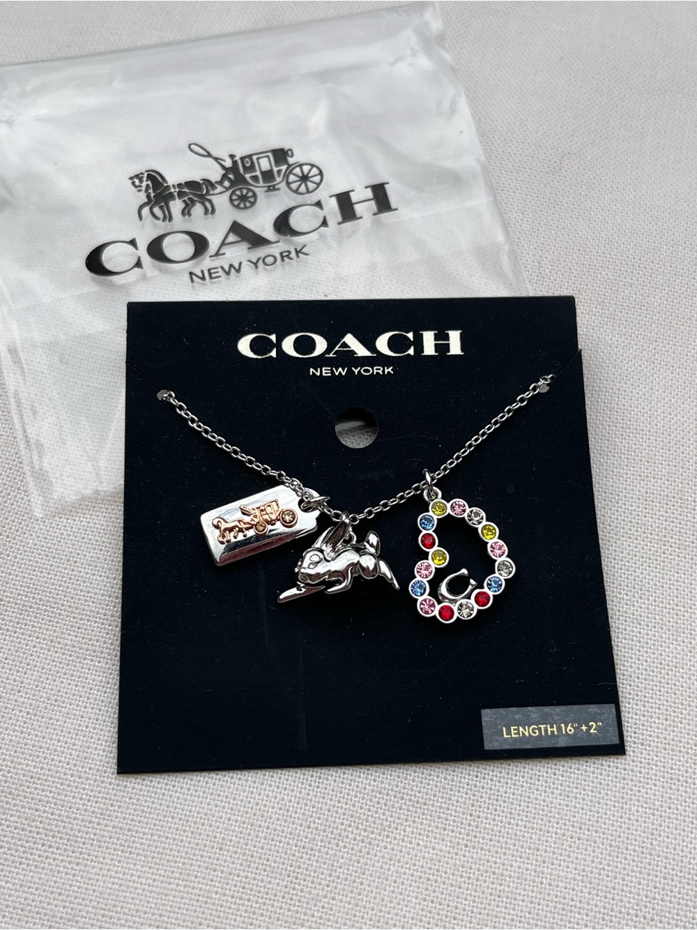 Coach Silver-Tone Charm Necklace with Heart, Bunny and Tag